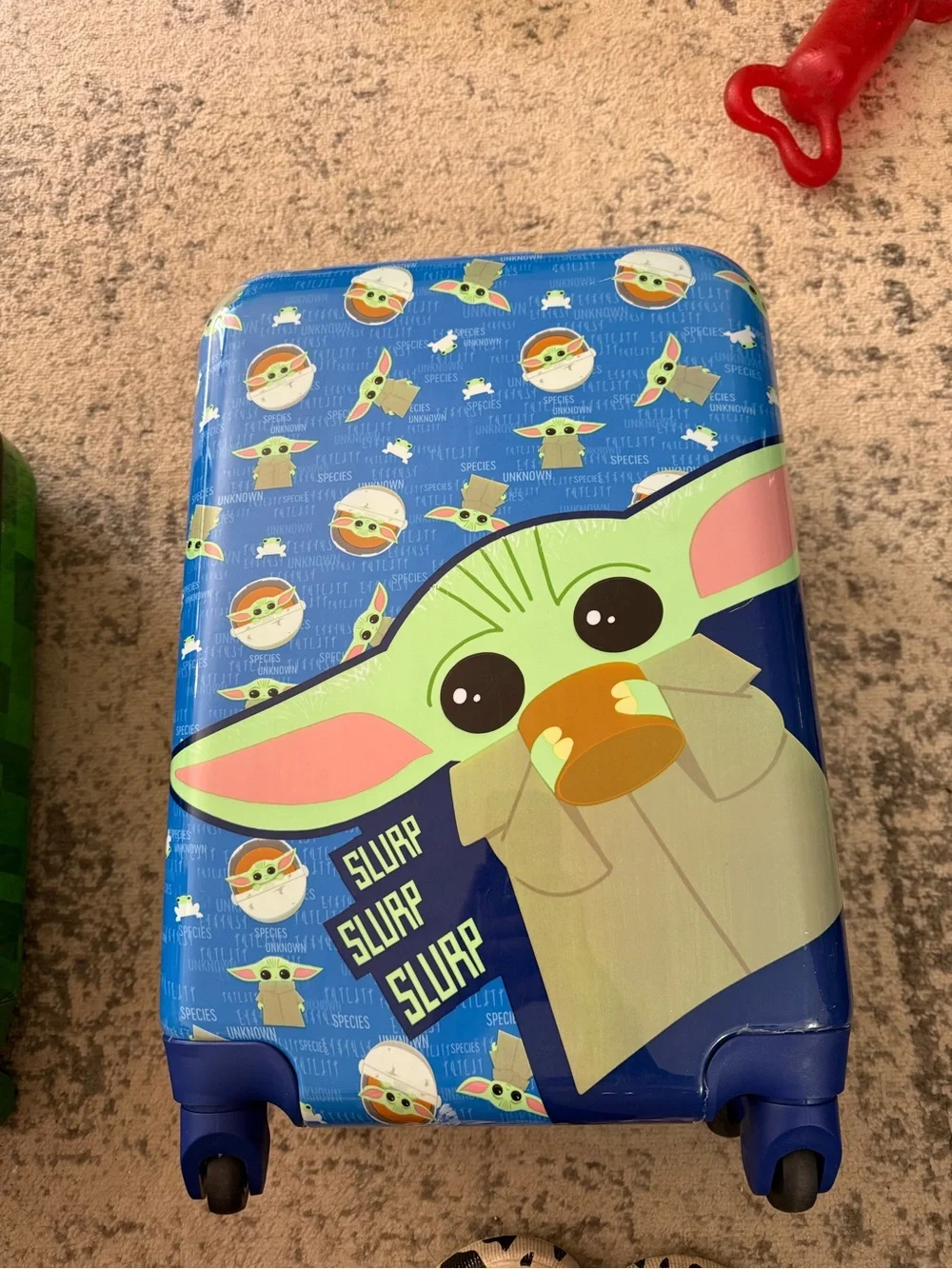 The Childs Grogu Blue Rolling Suitcase for Kids